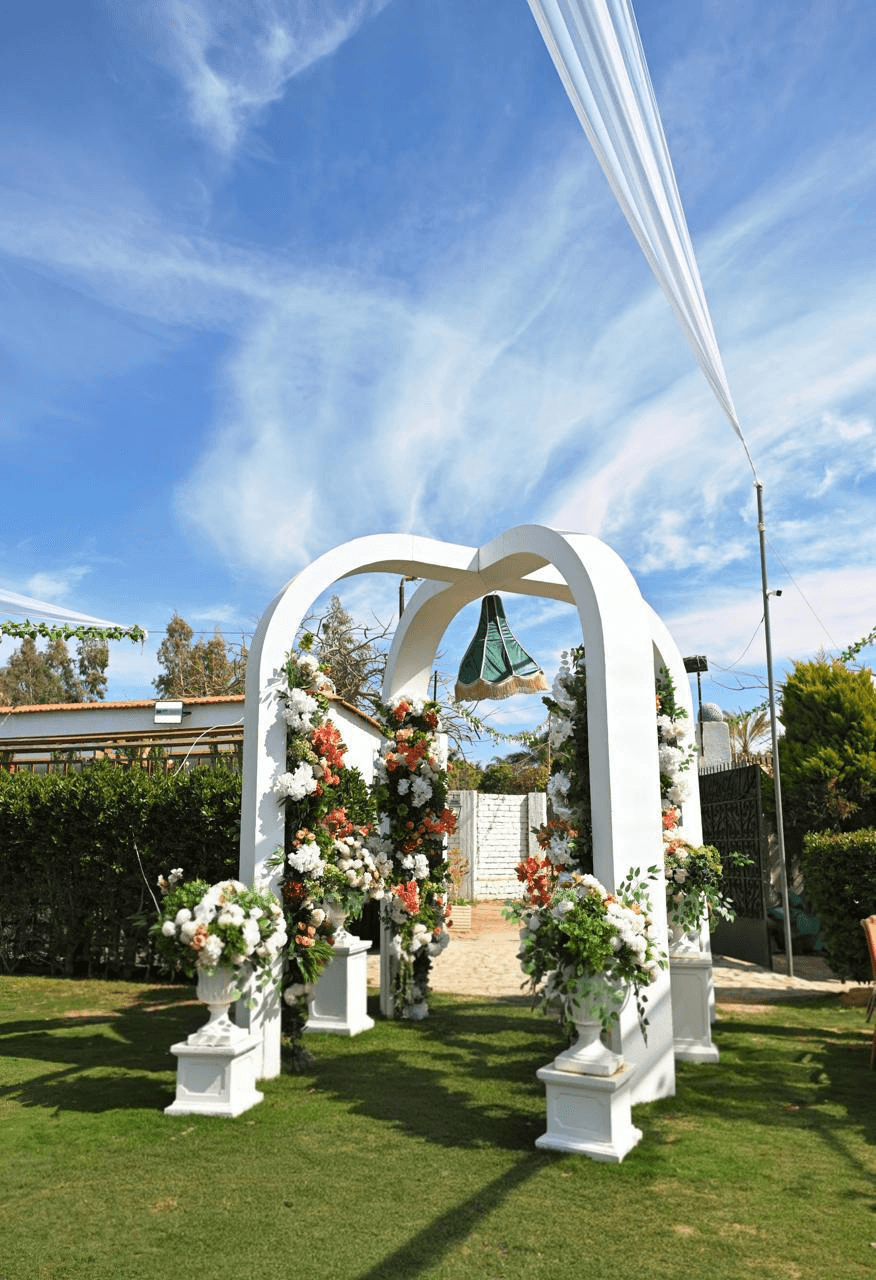 White arch and ceremony setup
